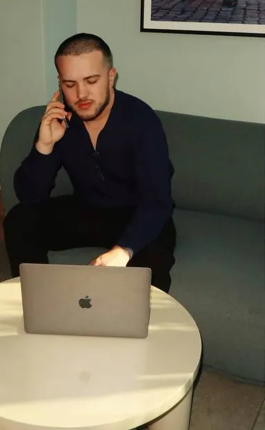 Yurii on a phone call with a client